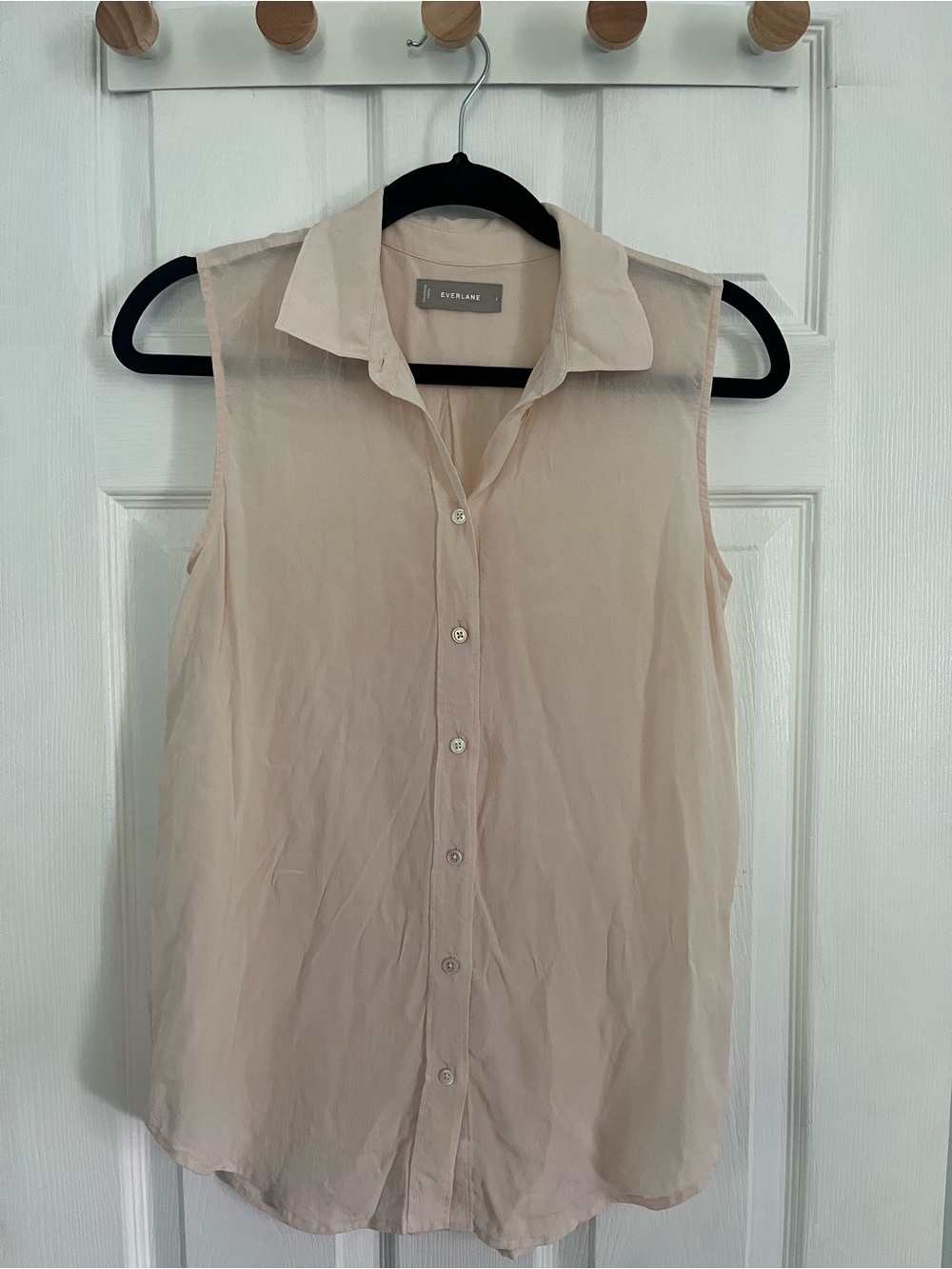 Blush sleeveless silk button down